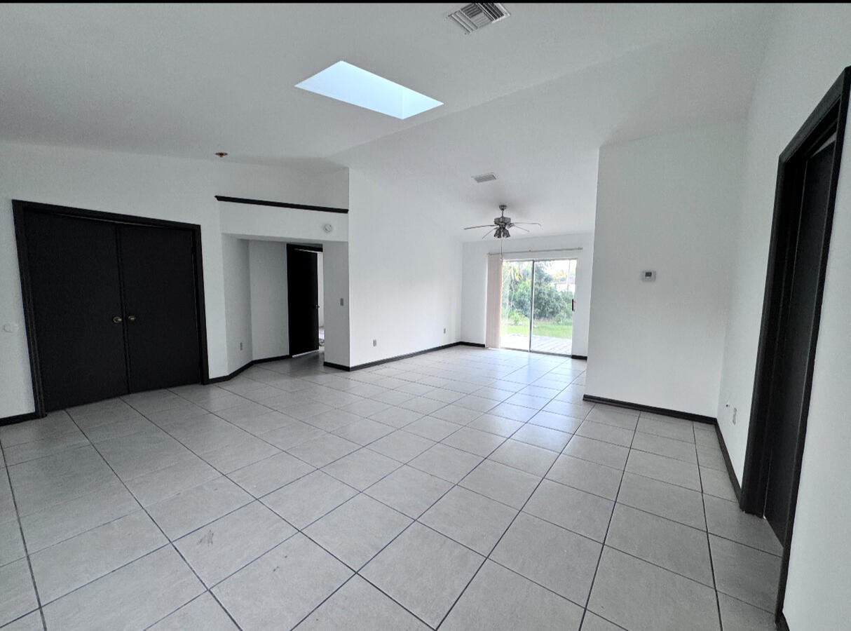 Clean white walls, refreshed trim, and floor sealer upgrade