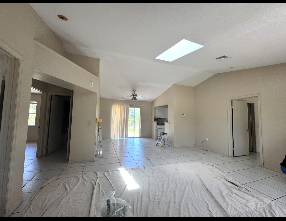 Dull beige interior with scuffed baseboards